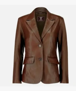 Close-up detail of the soft lambskin texture and two-button closure on a stylish women's blazer.