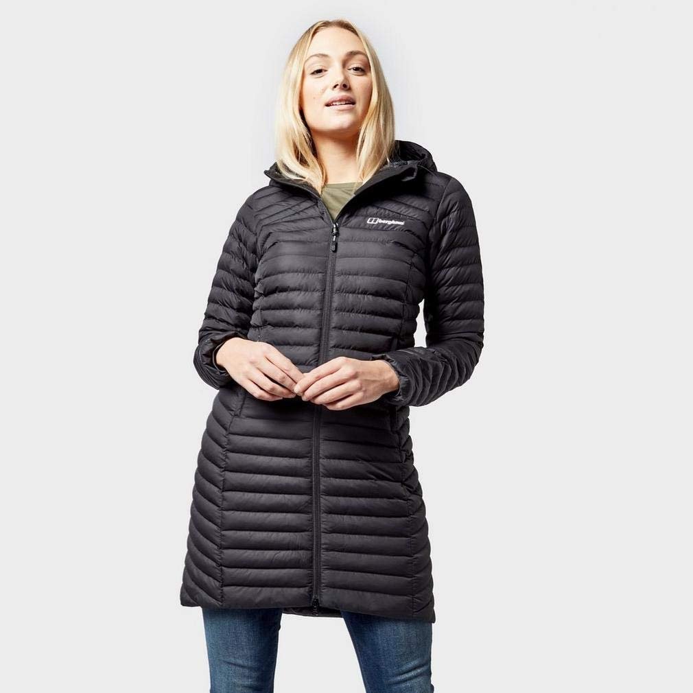 Woman wearing a long insulated Berghaus Nula Micro jacket outdoors.